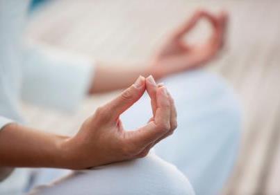 Description: Couple Practicing Yoga Together With Hands Joined